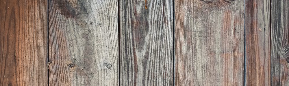Old burnt wood board. Barn wood background with copy space.